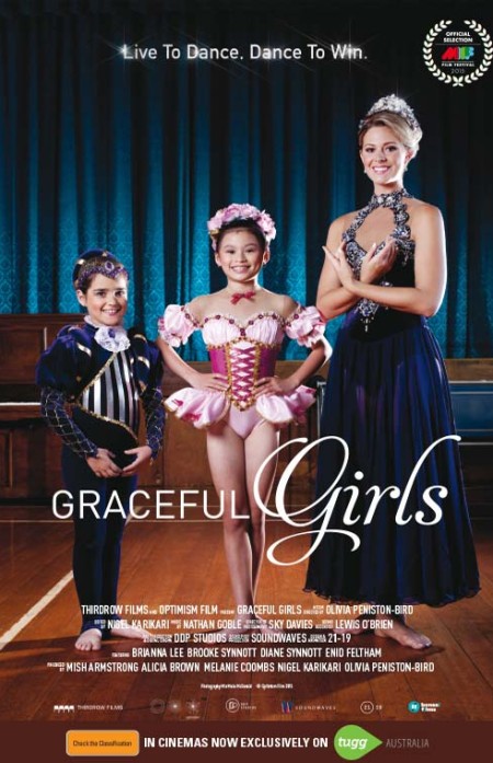 3 Dancers standing in a row with the youngest being about 5 and the eldest about 20 all in costume.